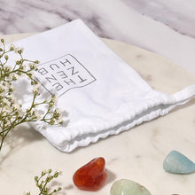 Load image into Gallery viewer, a white cotton bag with the zen hub logo on displayed in white marble background