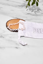 Load image into Gallery viewer, rose quartz heal bracelet laid of wooden board with white drawstring bag