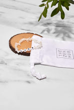 Load image into Gallery viewer, moonstone luck bracelet on a wooden slice accompanied with white drawstring bag