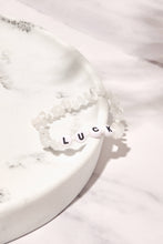 Load image into Gallery viewer, Lucky moonstone bracelet presented on white marble background
